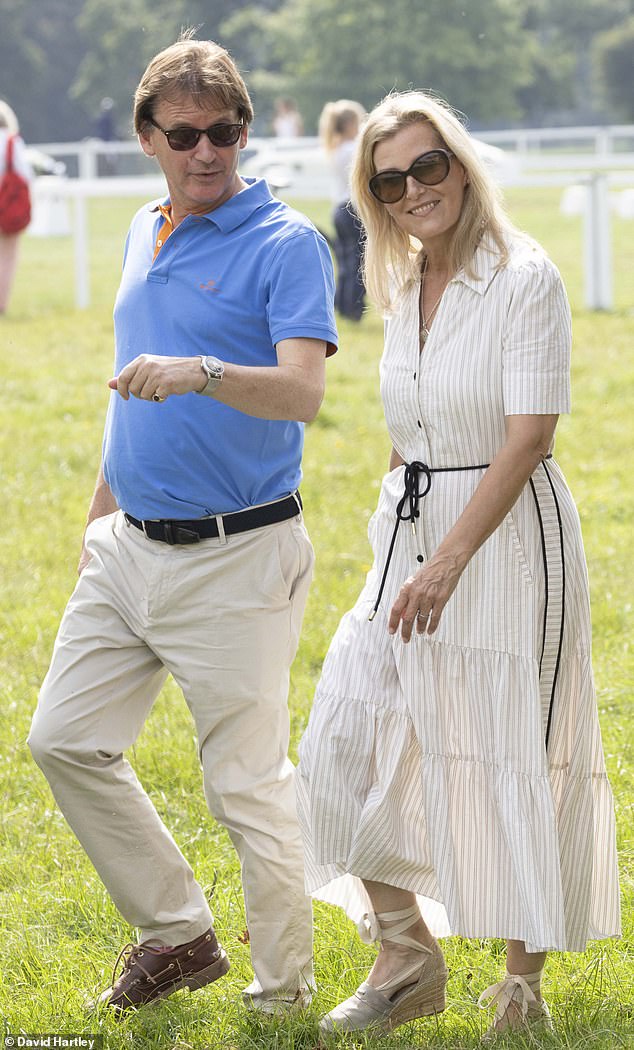 The royal family, who developed a close bond with the late Queen, was photographed with Mark Foster Brown (pictured right)