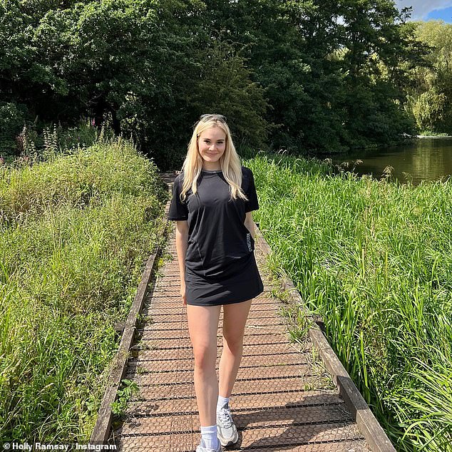 Stunner: She then wore a black T-shirt dress with white sneakers and socks