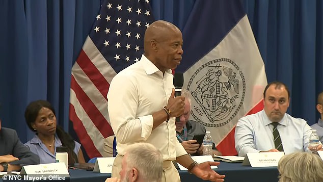 New York Mayor Eric Adams discussed the migrant crisis at a town hall on Wednesday, warning it will 'destroy' the Big Apple