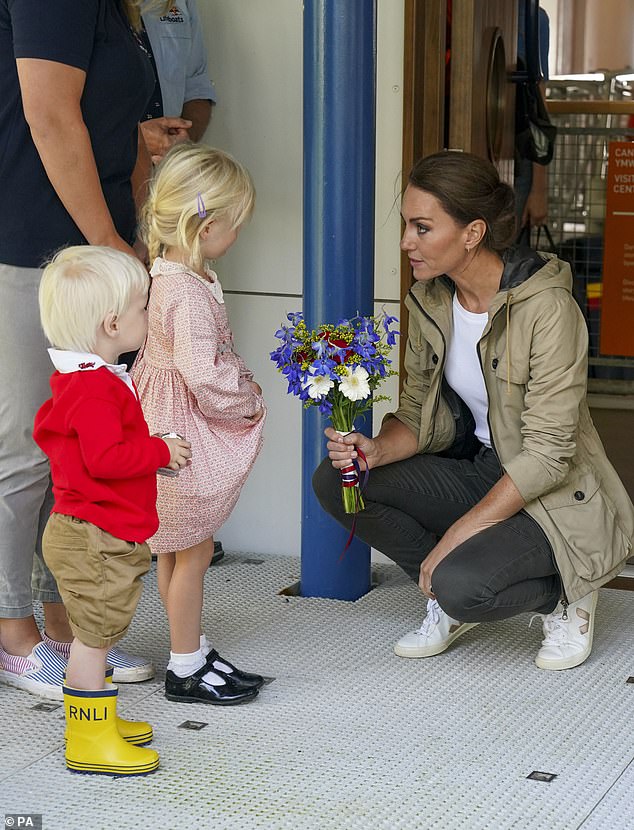 The Princess of Wales speaks to young children during a visit to the RNLI lifeboat station in St Davids