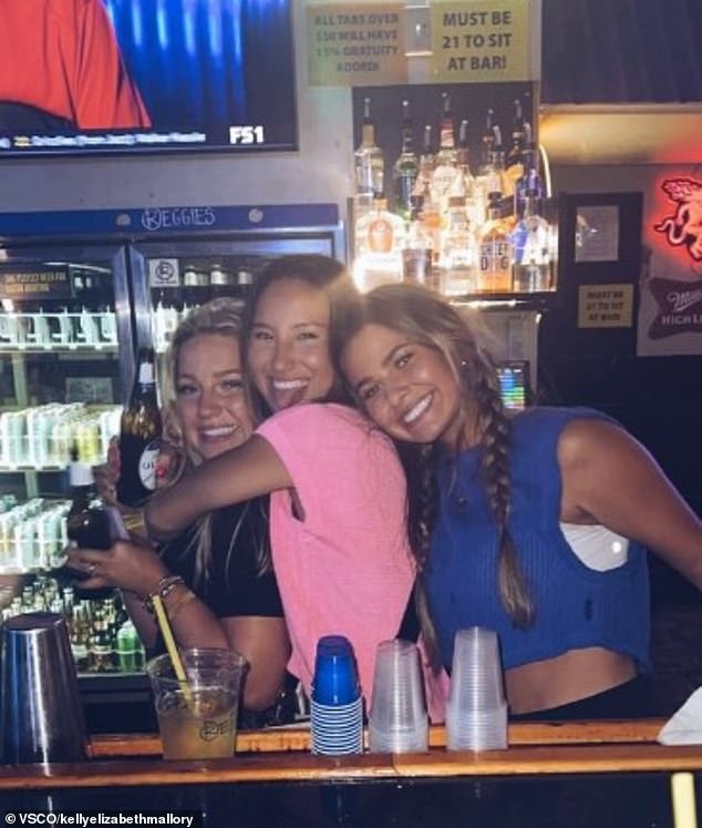 Madison Brooks (left) seen behind the bar at Reggie's with two sororities