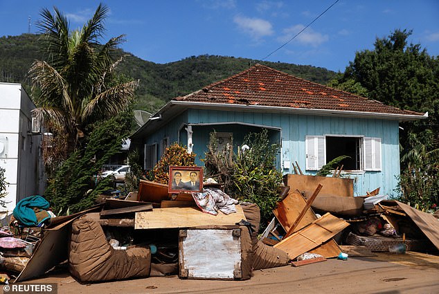 Residents' belongings are seen clearing a flooded area after an extratropical cyclone struck the southern Brazilian city of Muçum