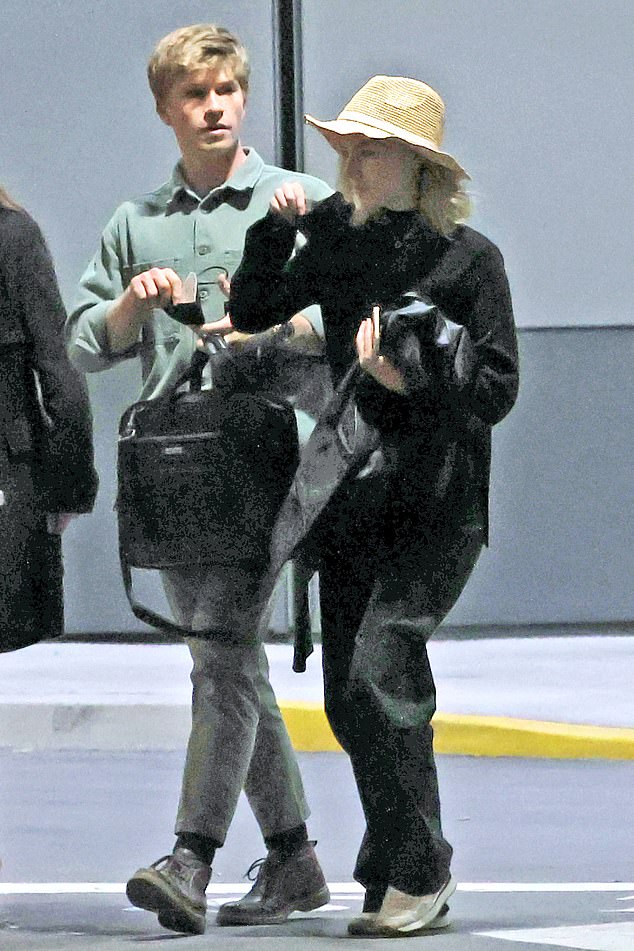 Robert, his new boyfriend and his mother were photographed together at Melbourne's domestic airport on Friday