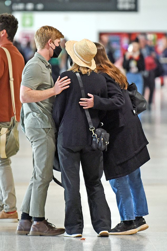 Despite only recently making their relationship public, Terri appears to be very close to her son's new girlfriend as all three were seen cuddling in the terminal.