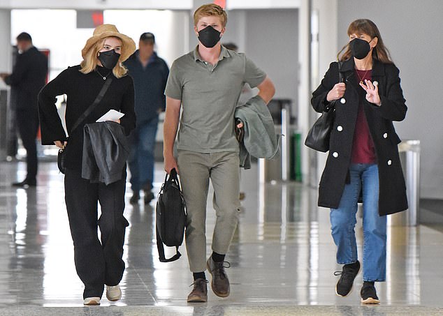 They all walked through the airport in masks