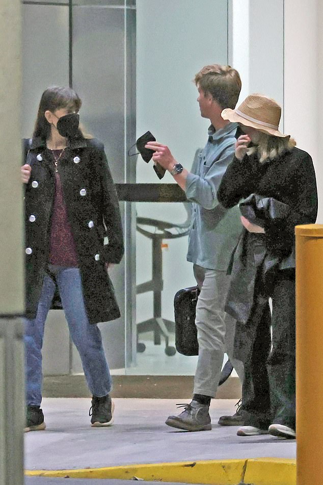 The trio looked happy as they made their way to a waiting car