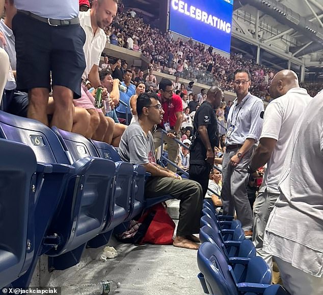 The troublesome protester glued his feet to the concrete floor below him, angering thousands after leading to a lengthy delay on Thursday evening.