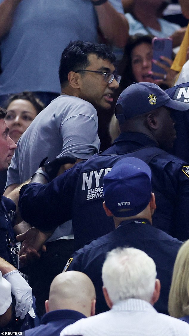 The protester glued his feet to the concrete at Arthur Ashe Stadium late Saturday evening