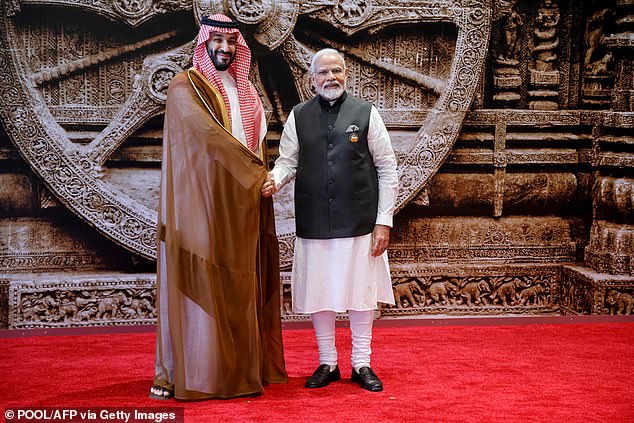 Indian Prime Minister Narendra Modi (right) shakes hands with Saudi Crown Prince and Prime Minister Mohammed bin Salman (left) as he arrived at Saturday's G20 meeting