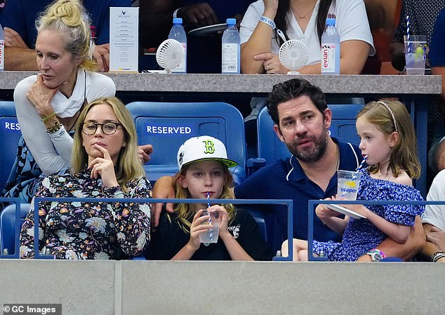 Devoted: Krasinski played the role of cool dad and let the couple's youngest, Violet, seven, sit on his lap