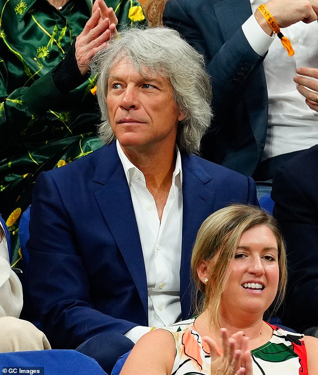 Cool Cat: Jon Bon Jovi, who is also a long-time tennis fan, looked elegant in a blue blazer as he sat with his wife and friends