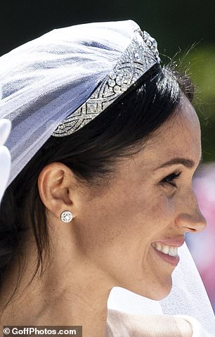 Meghan was seen smiling at the crowd after marrying Prince Harry