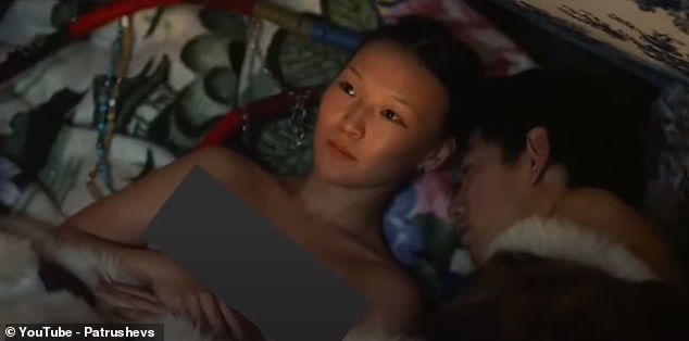 The film shows the bride crawling into bed next to her husband at nightfall, with a small canopy being the only thing separating them from the rest of the family.