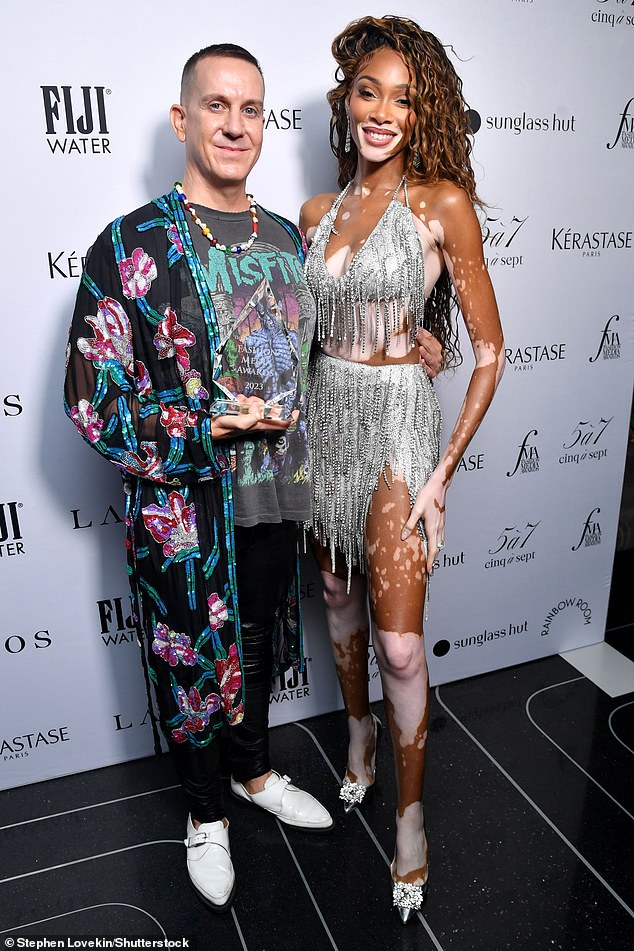 Stunning: The beauty put on a leggy display in a matching silver fringe and sequin set and was also joined by fashion designer Jeremy Scott