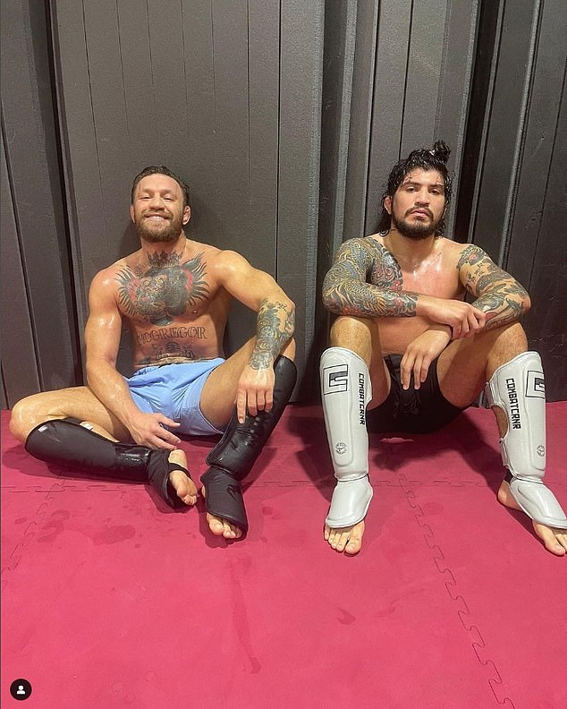 Danis rose to prominence through mixed martial arts after working closely with Conor McGregor (L)