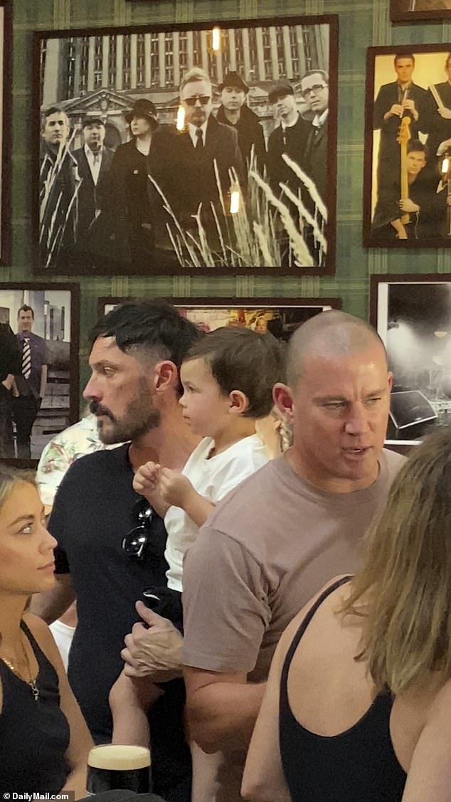 Casual cool: Channing wore a tan shirt and a shaved head for the outing