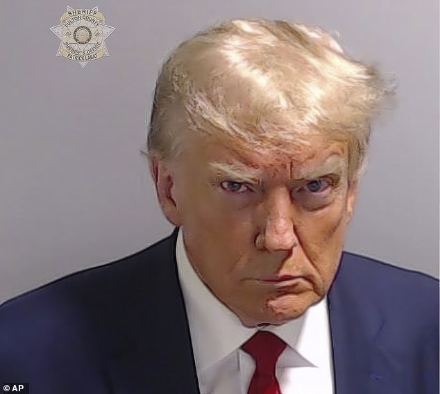 Shaw had a close-up of Trump's processing in jail, where the former president sat with a defiant pose for his booking photo