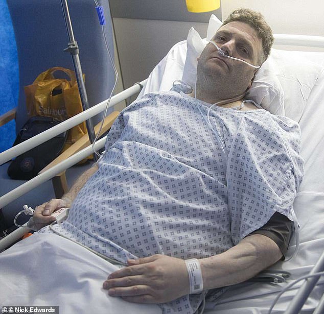 Andrew, pictured in hospital, successfully underwent the final stage of penile implant surgery at London's University Hospital