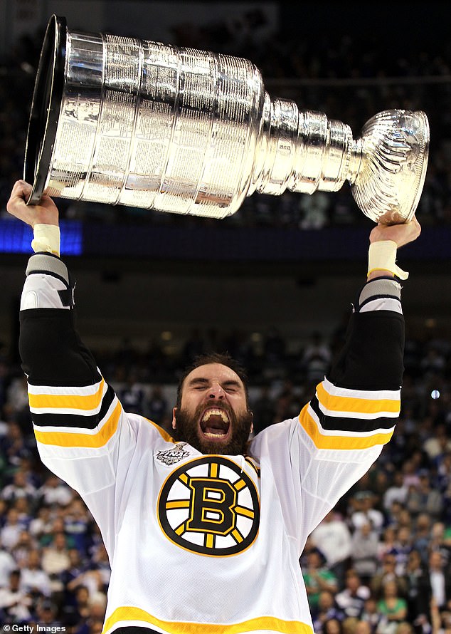 Chara celebrates with the Stanley Cup after beating the Vancouver Canucks in 2011