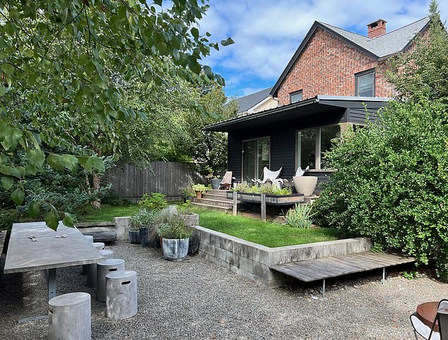 The couple eventually married a year after purchasing in the backyard of their $650,000 home, pictured, in upstate New York