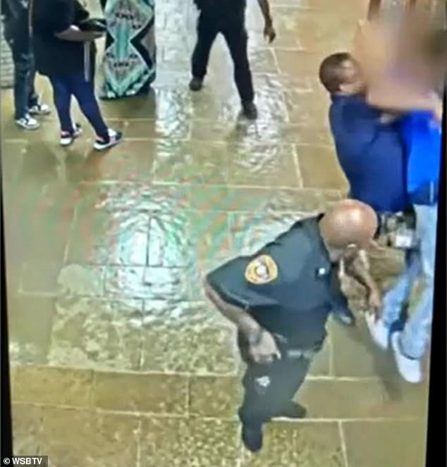 In the video, Gober is seen approaching the 17-year-old Redan High School student from behind and throwing him to the ground