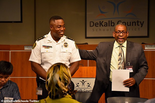 Chief Gober (L) and Dr.  R. Stephen Green (R) standing as they speak to delegates.  Gober is currently on paid leave for his actions