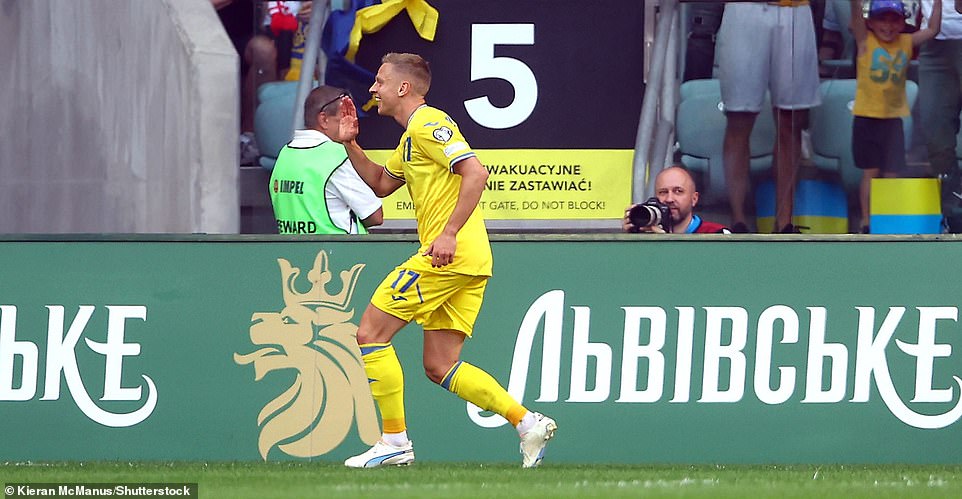 Arsenal star and national talisman Zinchenko held his hand to his ear and smiled into the cameras before showing a love heart