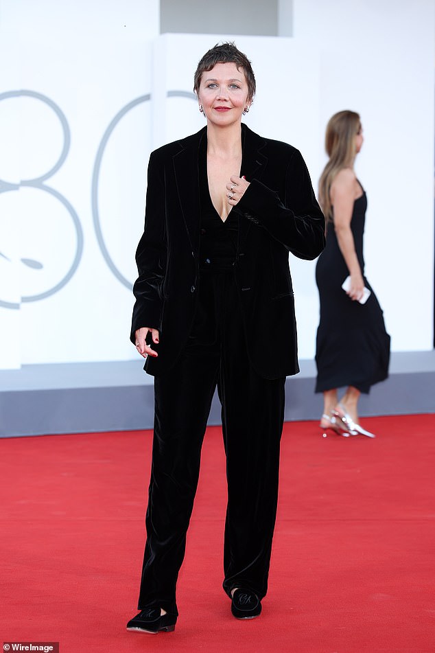 Style: The ladies were all smiles as they posed for photos at the event, with Maggie looking elegant in a plunging black velvet top, worn with a matching blazer and trousers
