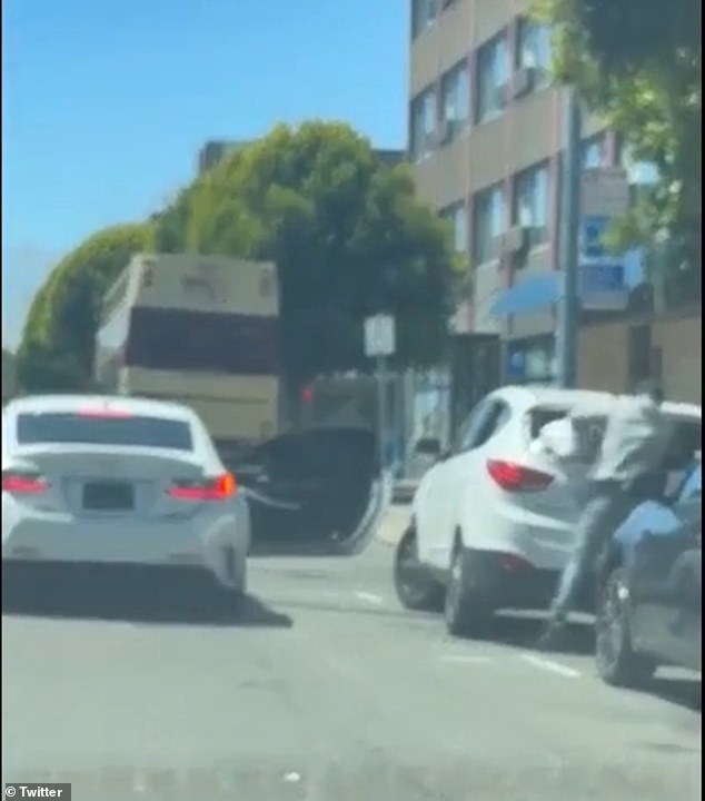 A brazen thief is caught on camera breaking into a white Lexus parked on a San Francisco city street.  The attack took place in broad daylight