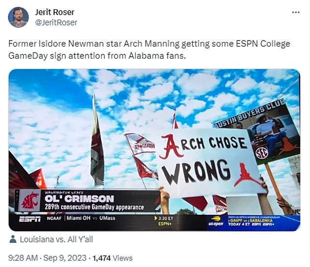 Another sign claimed that Manning made the wrong decision in choosing Texas over Alabama