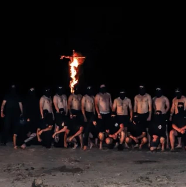 Pictured are a group of 'neo-Nazi skinheads' singing Waltzing Matilda, giving the Nazi salute and getting drunk while shouting 'white power' in a national park in Victoria