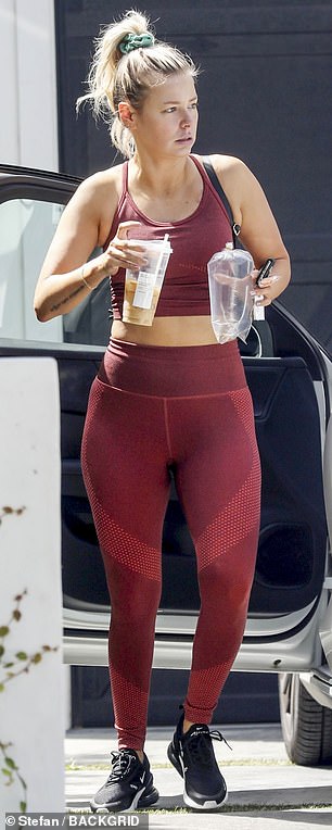 She looked super fit in a maroon workout set as she exited her white luxury vehicle