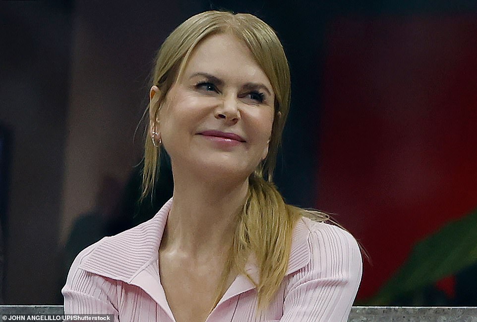 Pretty in pink: Nicole Kidman stuns in a pink top on the stands