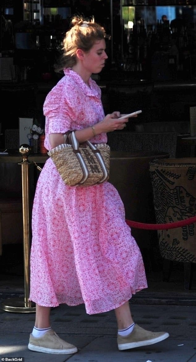 She wore her hair in a practical bun, perhaps because of the heat wave in Britain, where temperatures exceed 30 degrees