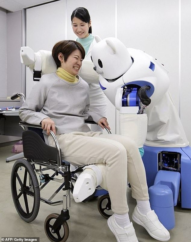 The 'Robear' has a cub-like face, but is sufficiently powerful to, for example, move patients from a wheelchair (photo) or a ground-level bed to a bath.  It weighs 140 kg and has extendable legs that prevent the 'bear' from falling over.  It moves slowly and smoothly thanks to advanced actuators in the mechanical arms.