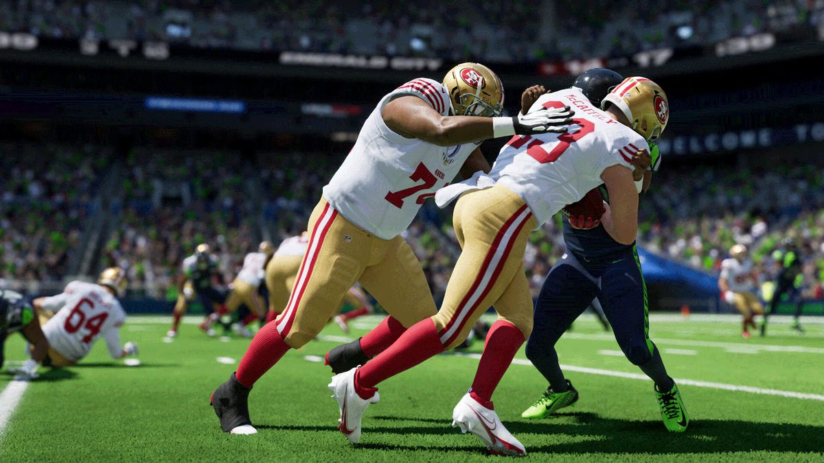 Christian McCaffrey is tackled on the sideline by a Seattle Seahawk in Madden NFL 24