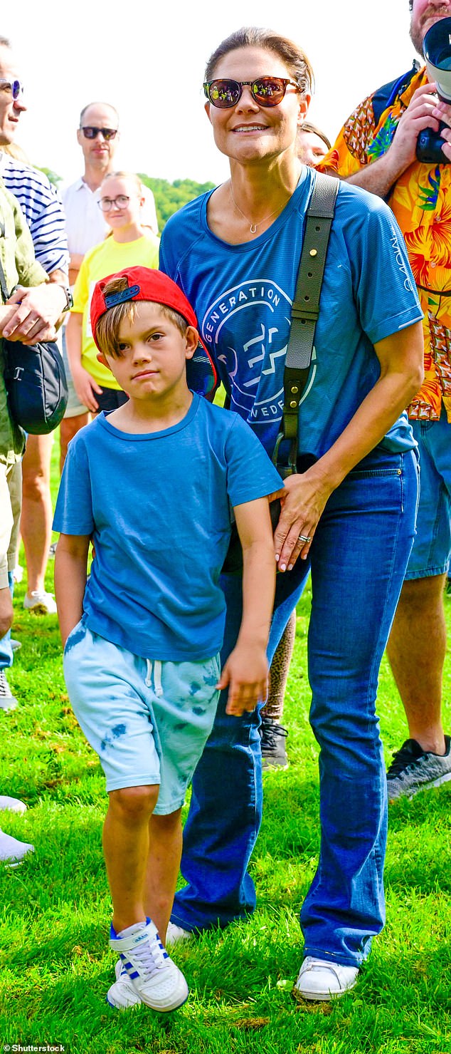 Prince Oscar, wearing seven casual clothes - a red cap worn backwards, a plain blue T-shirt, shorts and some trainers