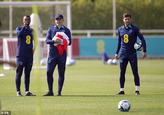 Carsley (centre) has also brought in Brighton midfielder Adam Lallana (right) into his coaching line-up