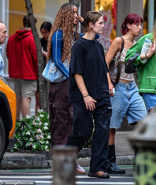 Malia was a few inches taller than both of her friends, despite wearing flat Adidas sneakers