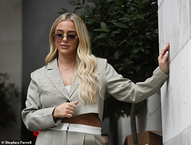 Pose: The influencer cut a stylish figure in an oversized suit from her own ASTALIA brand with a cropped blazer and high-waisted trousers