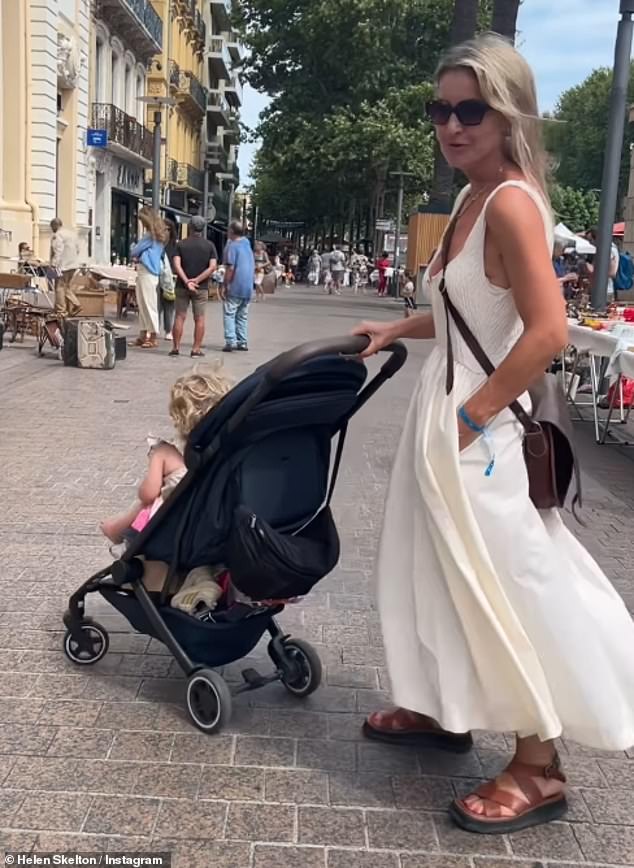 Style: Helen then donned a chic white summer dress as she explored the city