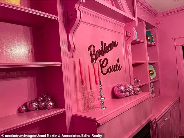 Barbie's castle has a built-in fireplace, shelves, cozy candles and pink disco balls