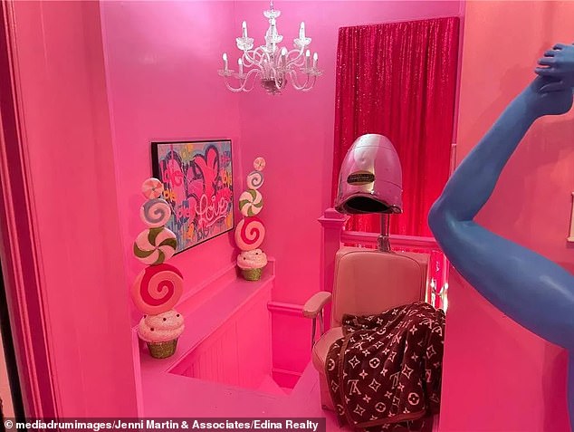 This Candy Land-themed bathroom features sequin curtains, a transparent chandelier, and even a nostalgic 1950s hair salon chair