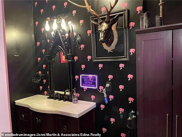 One of the bathrooms features Barbie's iconic image of her side profile as the background