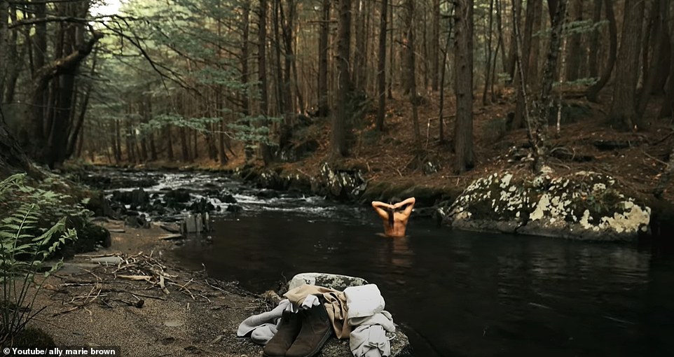 In one clip, the 25-year-old is seen wandering naked to the river to wash up