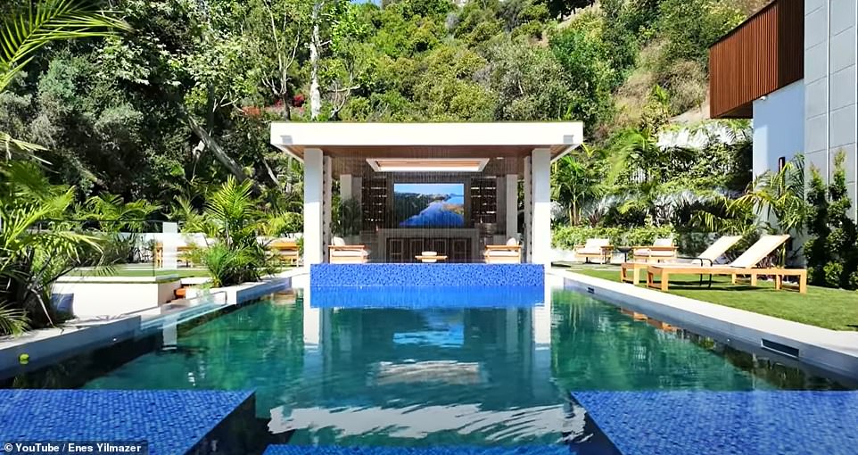 YouTube real estate expert Enes Yilmazer was given access to the home and even he was impressed by the sheer size of the home, along with its ultra-luxe amenities, ranging from a basketball court to an outdoor bar with a waterfall wall.