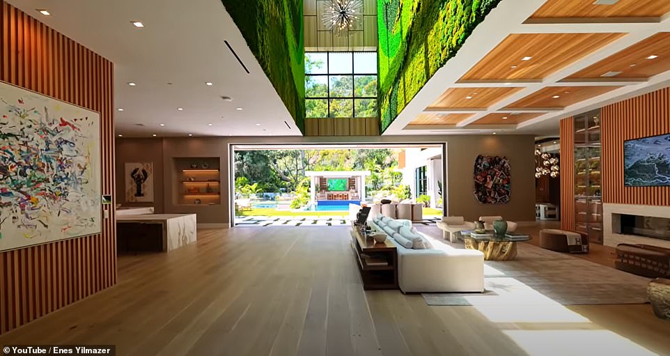 A view of the main living space, with skylights illuminating an interior wall