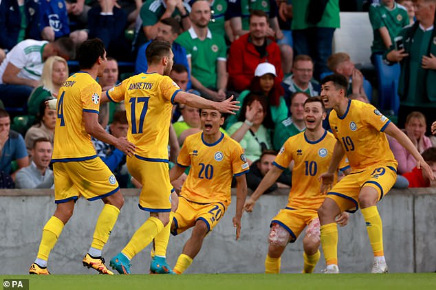 Maksim Samorodov (10) celebrates with his teammates after scoring the winning goal