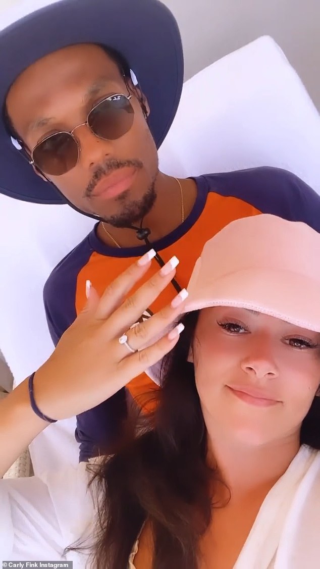 In the social media video, Carly was seen wearing her oval-cut diamond engagement ring