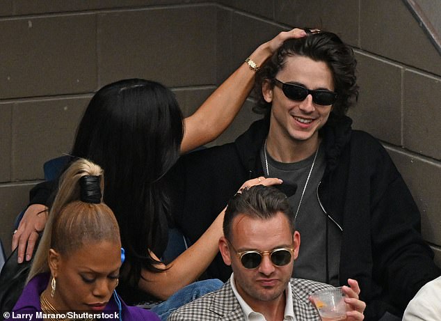 Cute: Kylie also tenderly ran her hand through the actor's dark curls at one point